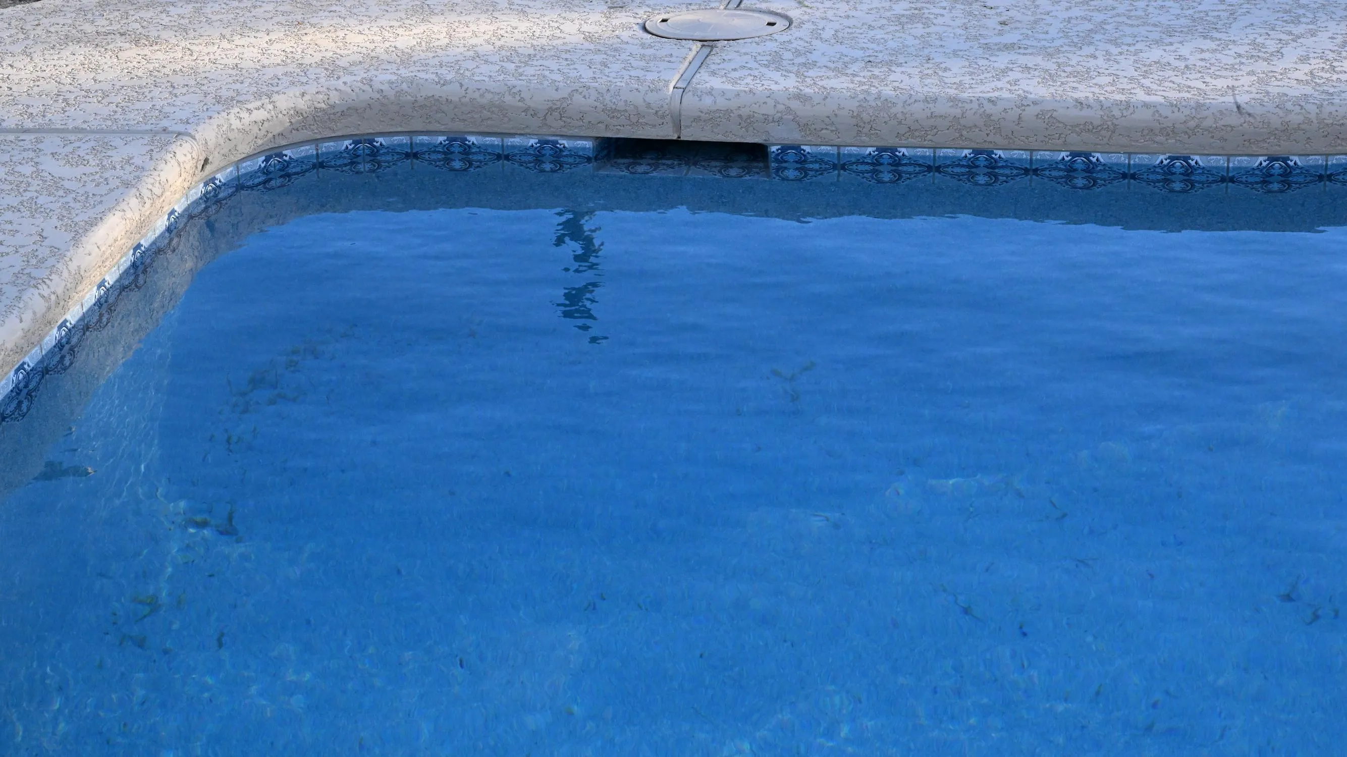 Freshly resurfaced blue-water pool in Tucson by Sorce Signature Outdoors