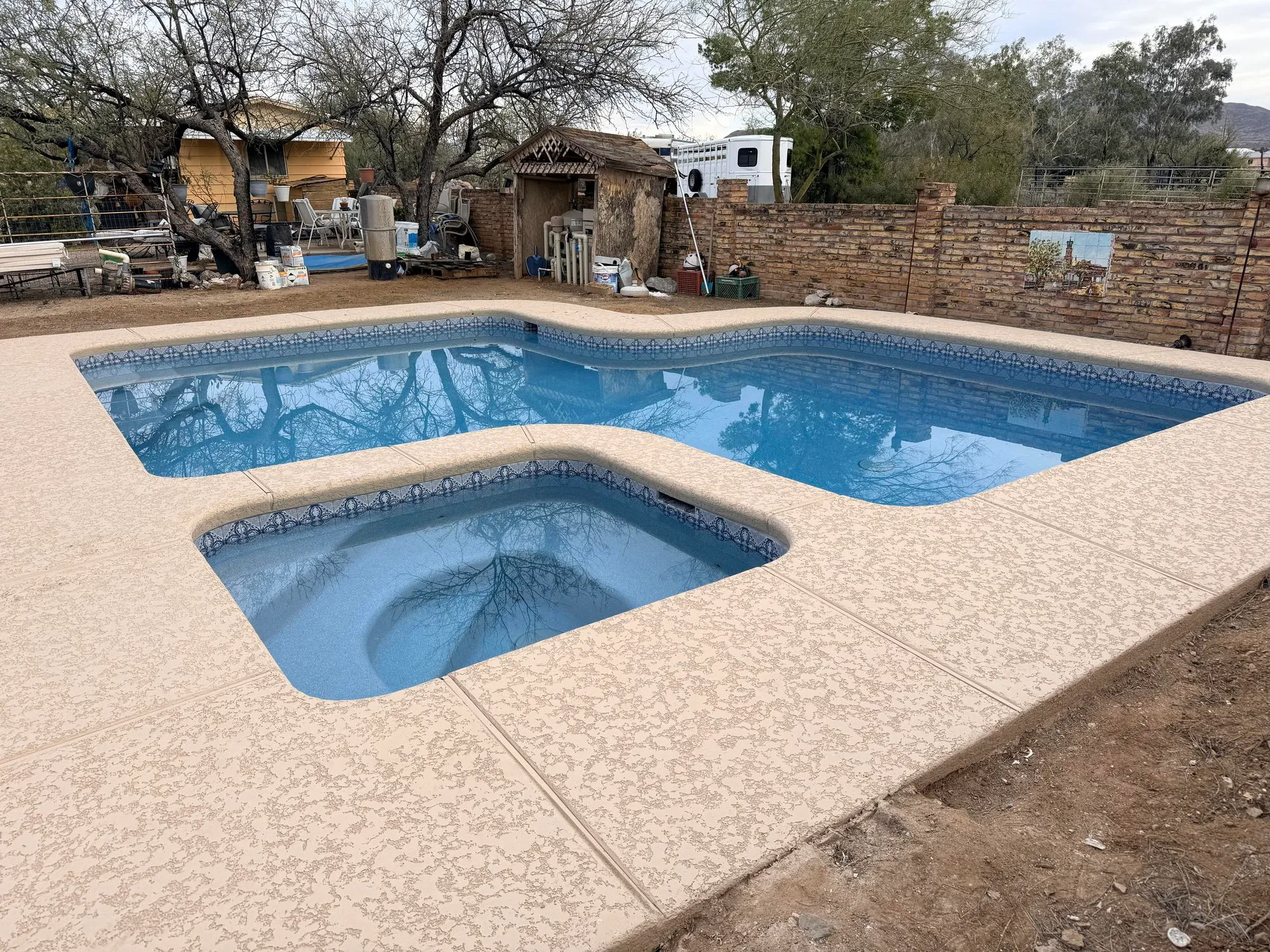 Custom inground pool and spa with paver decking by Sorce Signature Outdoors